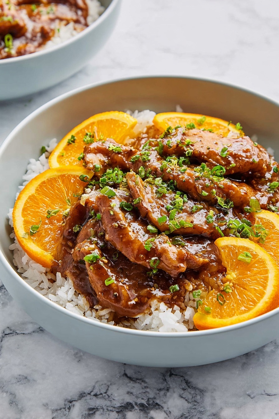 A white bowl is filled with a base layer of cooked white rice, topped with several pieces of golden-brown cooked meat covered in a thick, glossy brown sauce. Thin slices of orange with bright orange peel are placed among the meat chunks, adding a pop of color. Fresh green chopped scallions are sprinkled on top, providing contrast with the rich colors of the meat and sauce. The bowl sits on a white marbled surface, and part of another similar bowl is visible nearby. photo taken with an iphone --ar 2:3 --v 7