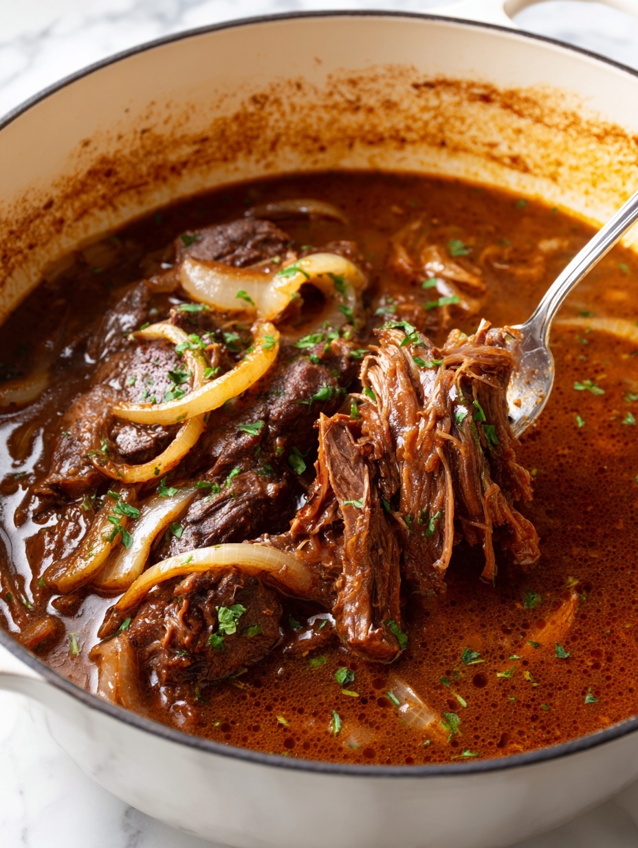 A large white pot filled with a thick brown stew, showing a tender piece of shredded meat in the center, surrounded by soft cooked onions in a rich sauce. The meat texture is stringy and moist, while the onions are translucent and caramelized, with small green herb pieces sprinkled on top. A metal fork is pulling at the meat from the right side, and the pot edges have dark brown cooked marks, all set on a white marbled surface with a white and gray striped cloth peeking from the bottom. photo taken with an iphone --ar 2:3 --v 7