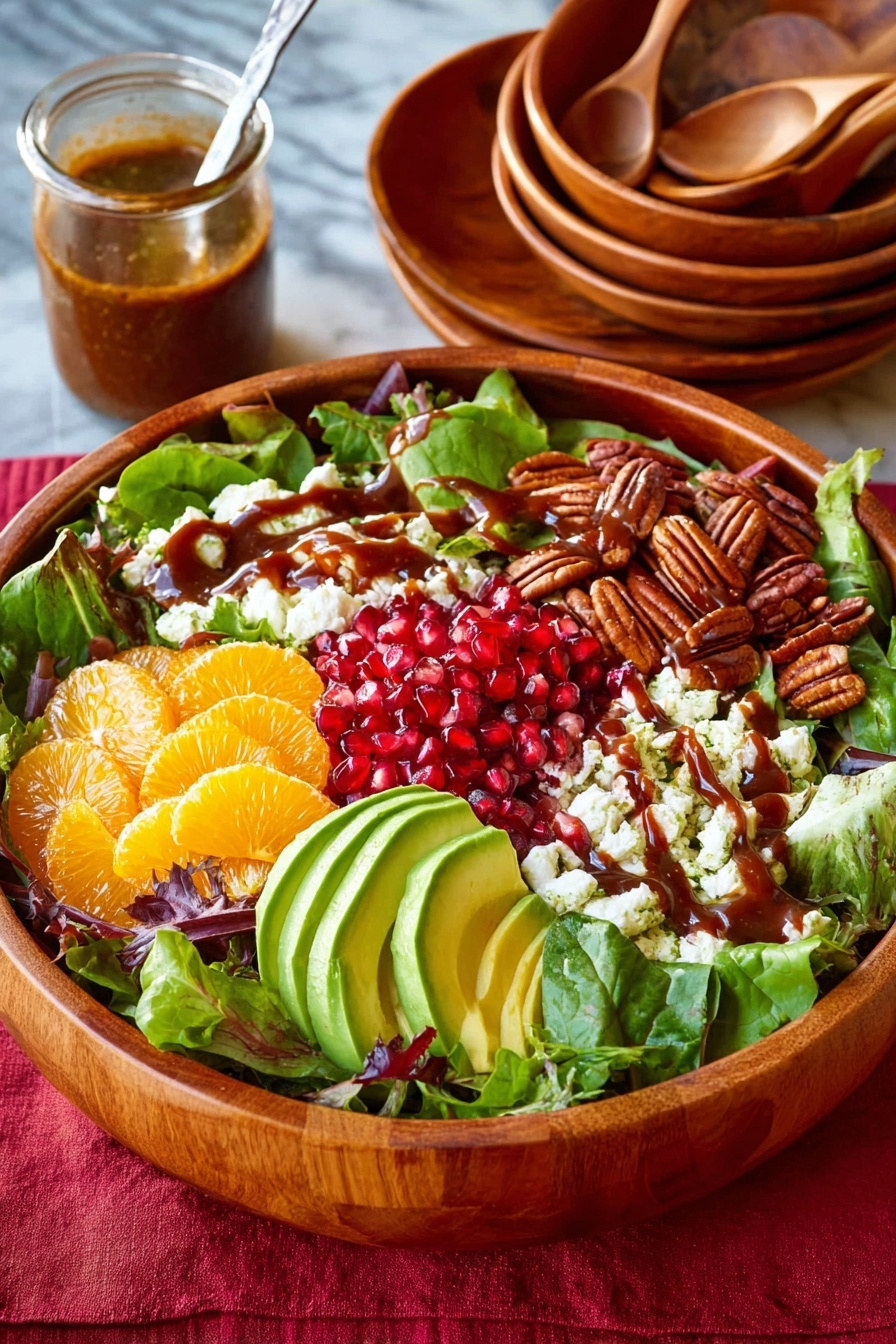 A large wooden bowl holds a fresh salad with six clear layers: at the bottom is a bed of mixed green leaves with different shapes and shades; on top, sections of bright orange citrus slices, white crumbly cheese, pale green sliced avocado with a smooth texture, dark brown glossy pecans, and bright red shiny pomegranate seeds are arranged in a circle; a thick dark brown dressing is drizzled over the cheese and avocado. In the background, there is a stack of wooden bowls with spoons on top and a small glass jar of dressing with a spoon inside, all set on a white marbled surface with a red cloth underneath the bowl. photo taken with an iphone --ar 2:3 --v 7