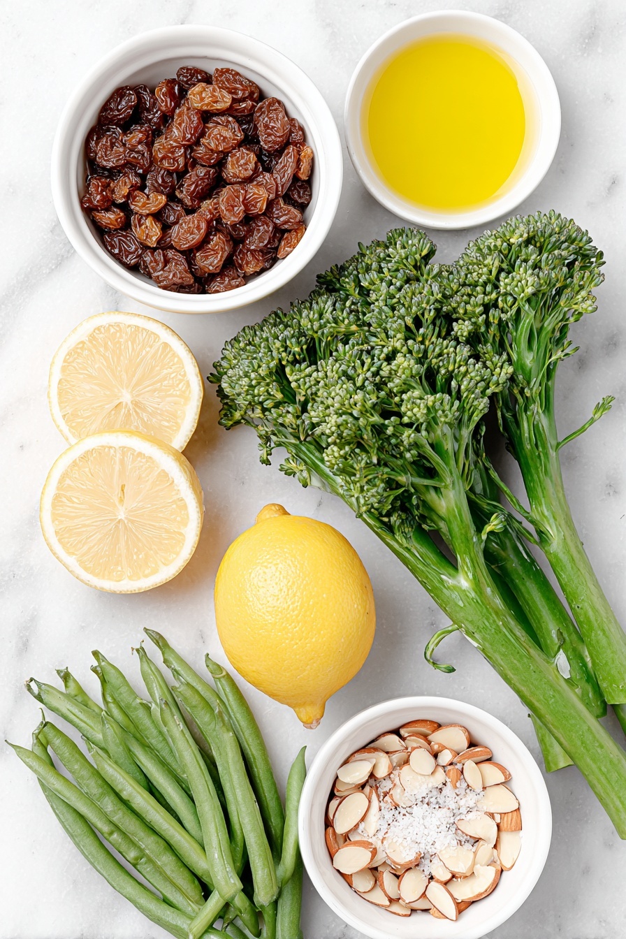 Flat lay of a bunch of fresh broccolini with tough ends removed, a neat pile of green beans with stems trimmed, a small white bowl of dried currants soaking in water, a small white bowl of golden olive oil, bright fresh lemon cut in halves beside thin lemon peel strips, two whole cloves of garlic unpeeled, a small white bowl of toasted sliced almonds, a small white bowl of clear water, a few sprigs of sea salt crystals and some cracked black peppercorns scattered lightly—all arranged symmetrically on a clean white marble surface, soft natural light, photo taken with an iPhone, professional food photography style, fresh ingredients, white ceramic bowls, no bottles, no duplicates, no utensils, no packaging --ar 2:3 --v 7 --p m7354615311229779997