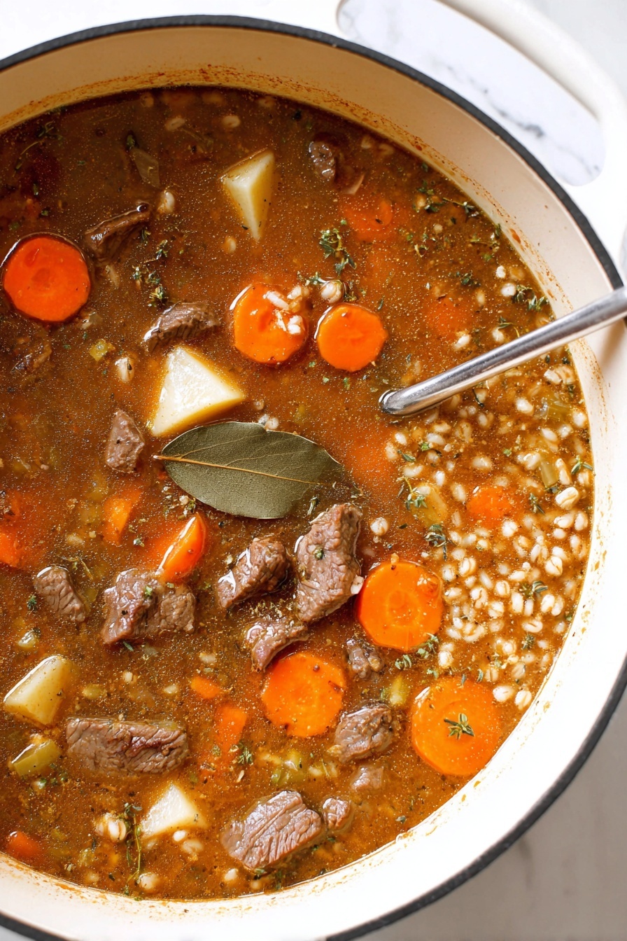 The image shows a close-up of a pot filled with beef stew. The stew has a brownish broth base with visible herbs and black pepper flakes throughout. There are chunks of brown beef, round slices of bright orange carrots, and large pieces of pale yellow potatoes floating in the soup. A dark green bay leaf rests on top near the center. Small bits of celery and grains add texture to the dish. The inner pot is white with a black rim, and it sits on a white marbled surface. A metal spoon is partially visible, resting in the stew. photo taken with an iphone --ar 2:3 --v 7