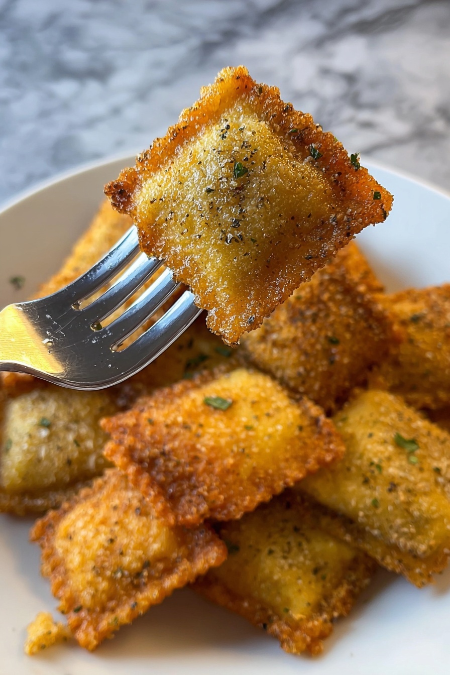 The image shows a silver fork holding a golden-brown, square-shaped, breaded food piece with visible specks of green herbs and a crispy texture. Below the fork, there is a white plate with many similar small, square, golden-brown breaded pieces scattered on it. The background is a white marbled surface that contrasts with the warm tones of the food. Photo taken with an iphone --ar 2:3 --v 7